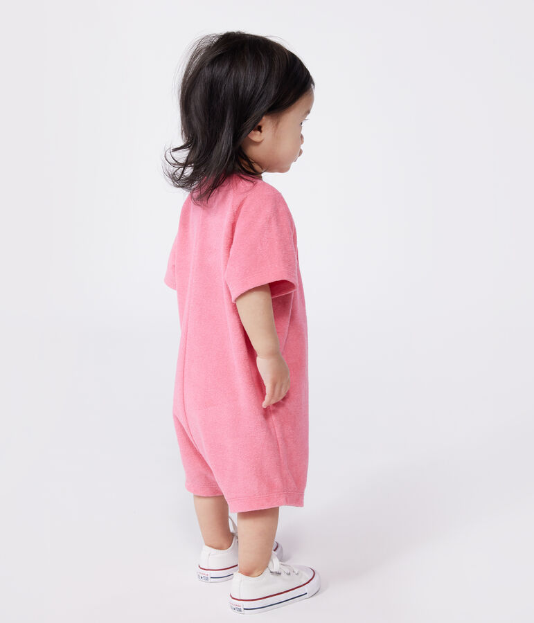 Babies' short-sleeved plain cotton towelling playsuit with a badge pink
