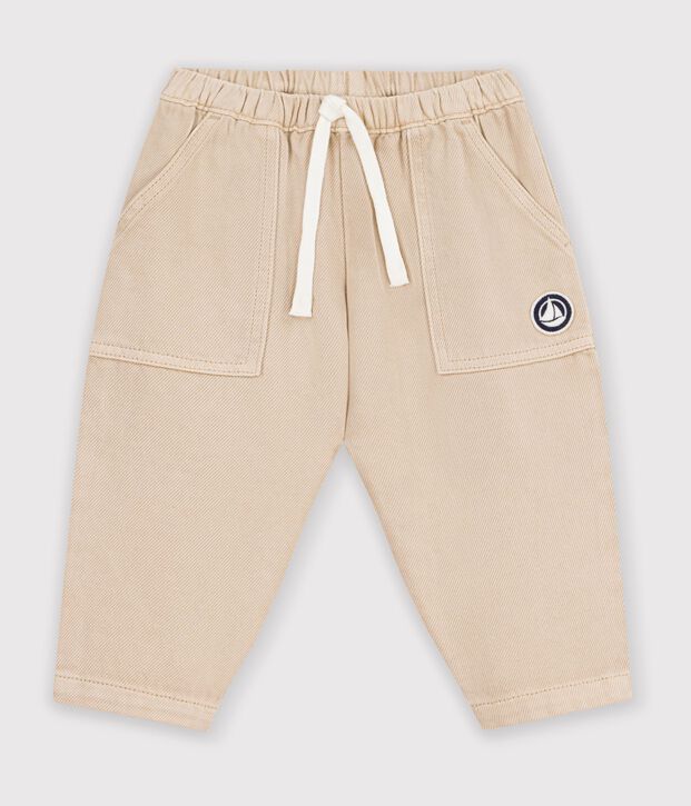Babies' cargo-style trousers in plain cotton with a badge beige