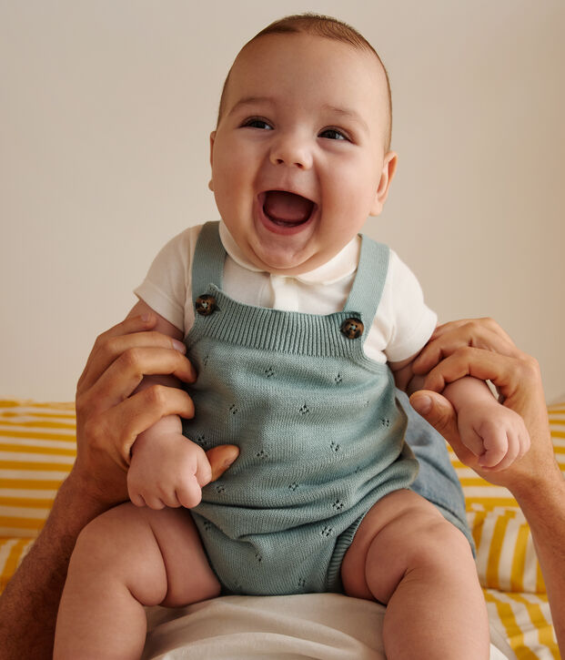 Babies' rompers knitted in a pretty pattern and with straps green