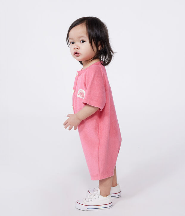 Babies' short-sleeved plain cotton towelling playsuit with a badge pink