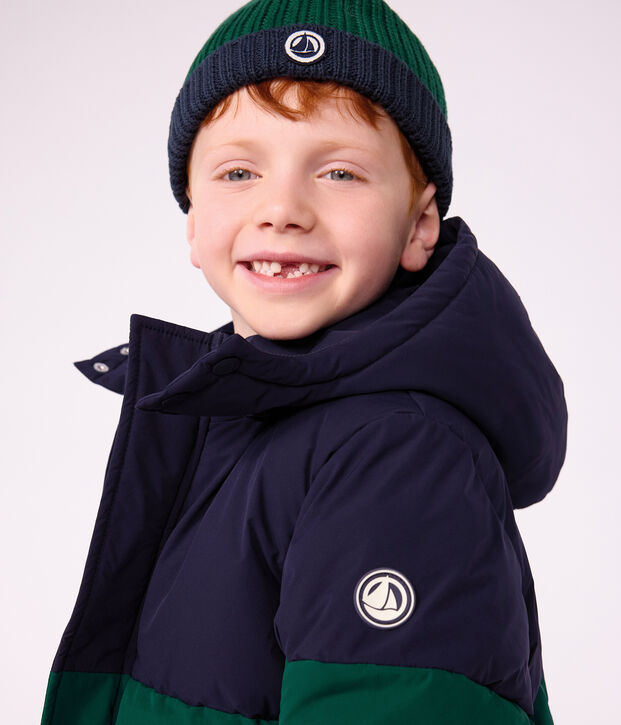 Children's two-colour knitted beanie with a fleece lining green/blue