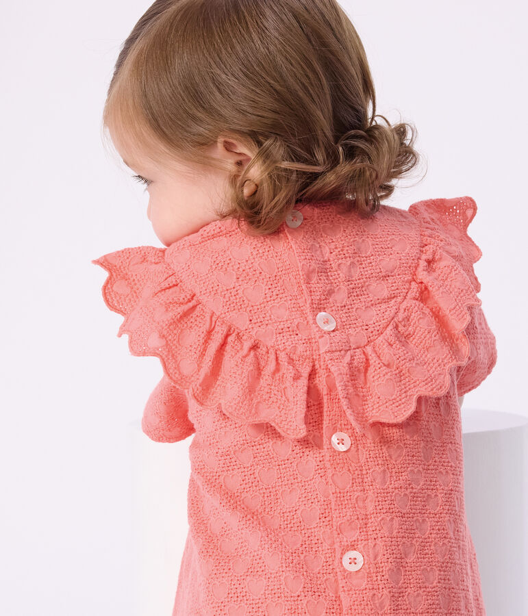 Babies' dress in broderie anglaise with short sleeves and a hearts motif pink