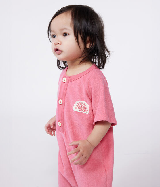 Babies' short-sleeved plain cotton towelling playsuit with a badge PEONIA pink