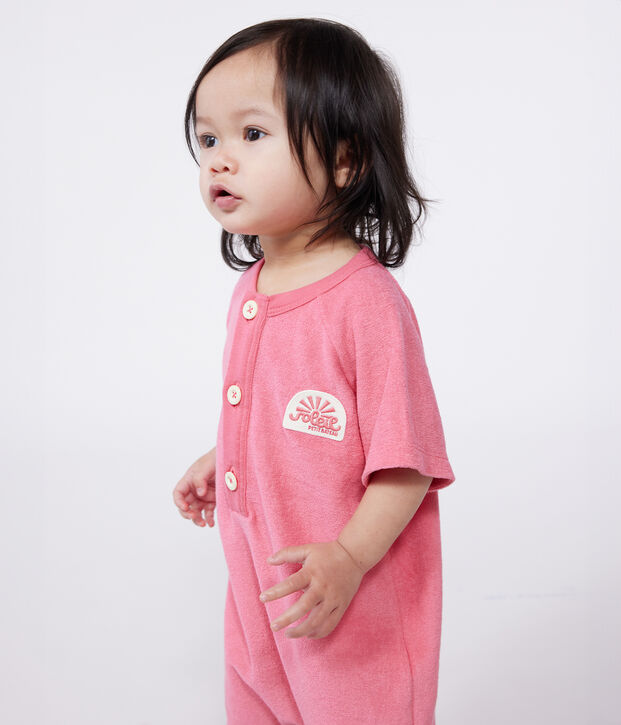 Babies' short-sleeved plain cotton towelling playsuit with a badge pink