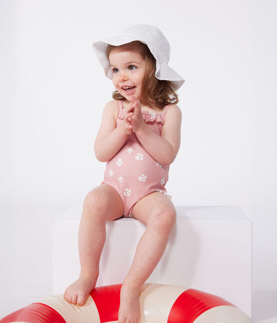 Babies' one-piece swimsuit with frills and a floral print. CHARME pink/MARSHMALLOW white