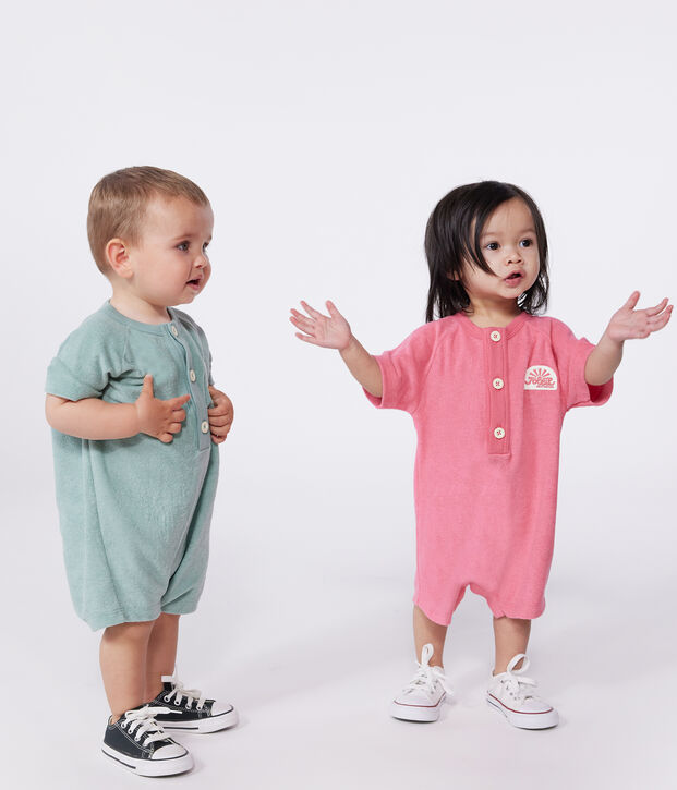 Babies' short-sleeved plain cotton towelling playsuit with a badge pink