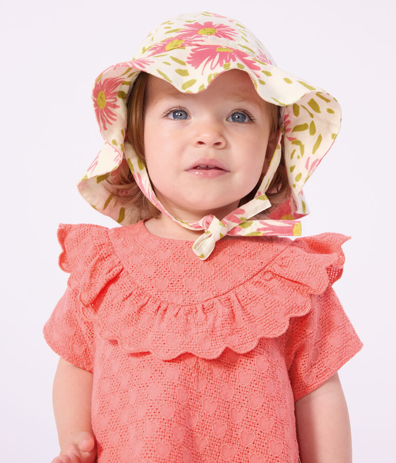 Babies' dress in broderie anglaise with short sleeves and a hearts motif pink