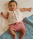 Newborn babies' two-piece cotton set with a ruffled blouse