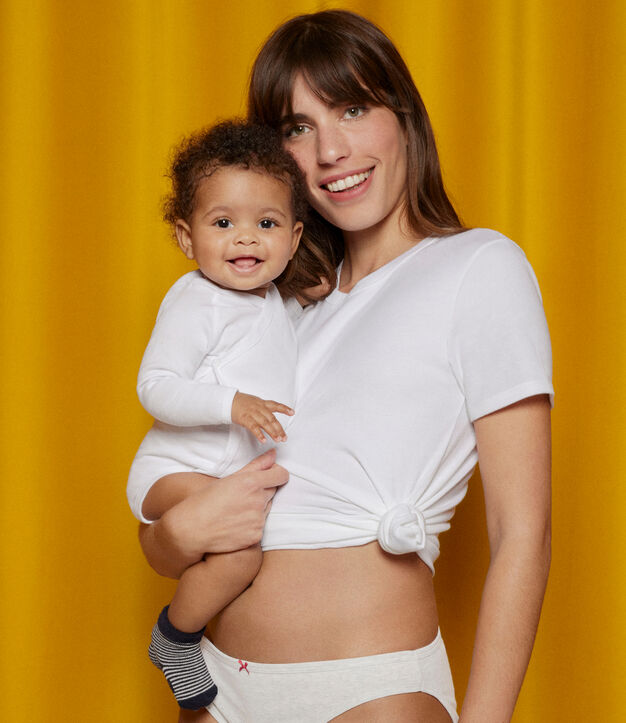 Mother and baby all in white